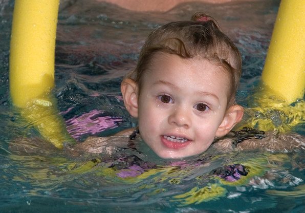 Swimming Class Child with Noodle